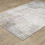 5' X 7' Beige Blue Grey Green Brown And Purple Abstract Power Loom Stain Resistant Area Rug