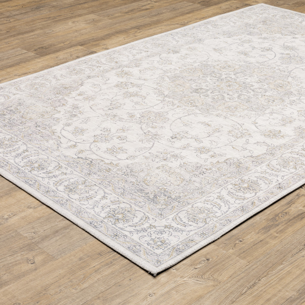 5' X 7' Beige Gold And Grey Oriental Power Loom Stain Resistant Area Rug