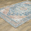 5' X 7' Orange Blue Teal Green And Beige Oriental Power Loom Stain Resistant Area Rug