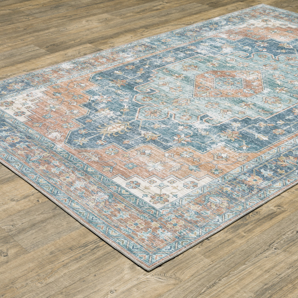 5' X 7' Orange Blue Teal Green And Beige Oriental Power Loom Stain Resistant Area Rug