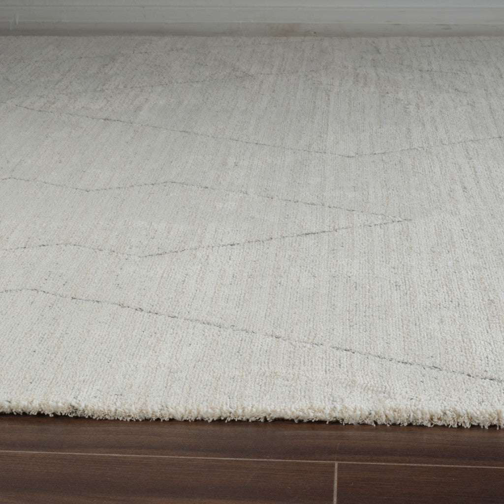 8' Cream and Beige Abstract Distressed Area Rug