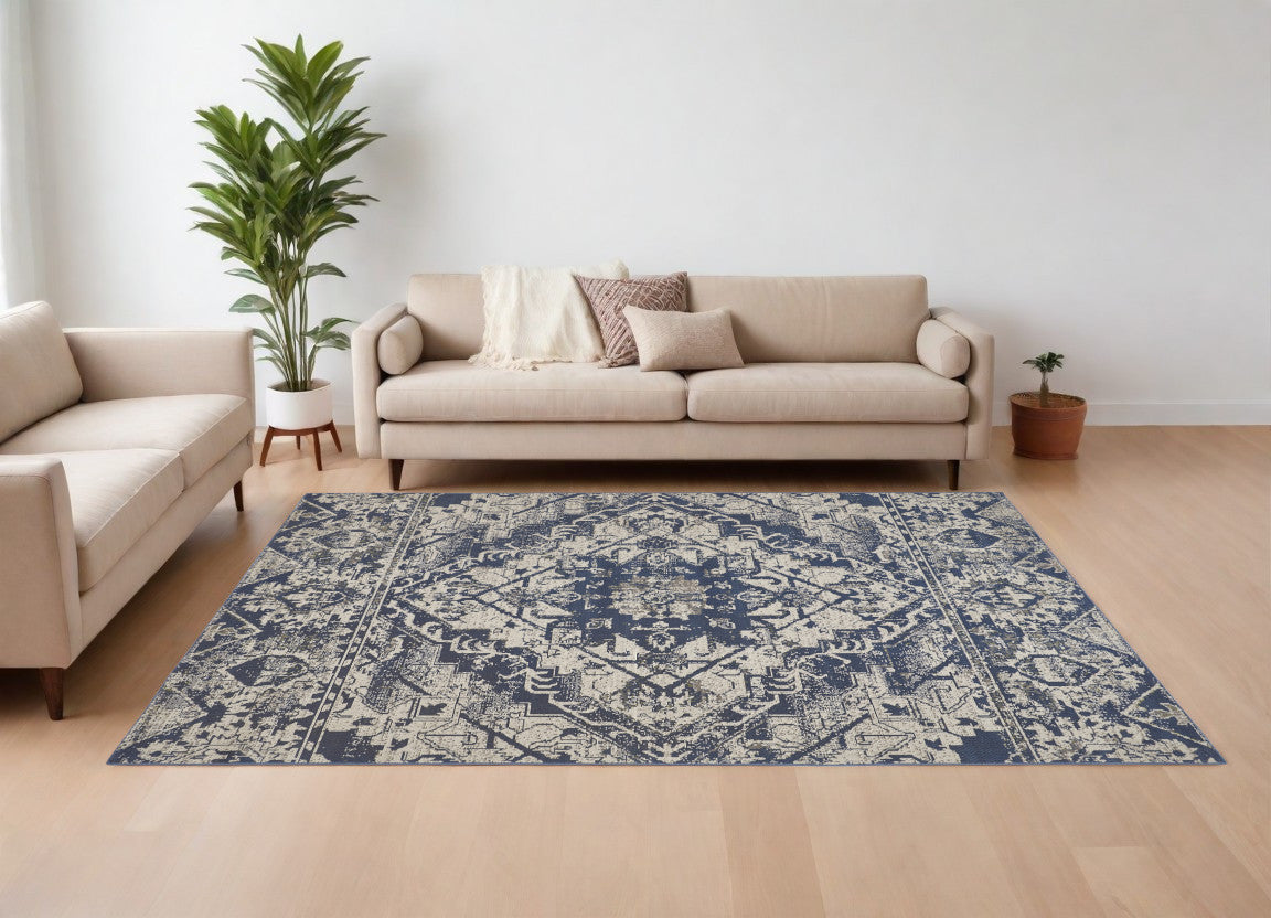 6' X 9' Gray Blue and Ivory Oriental Power Loom Area Rug